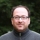 headshot of Bora Kalkan